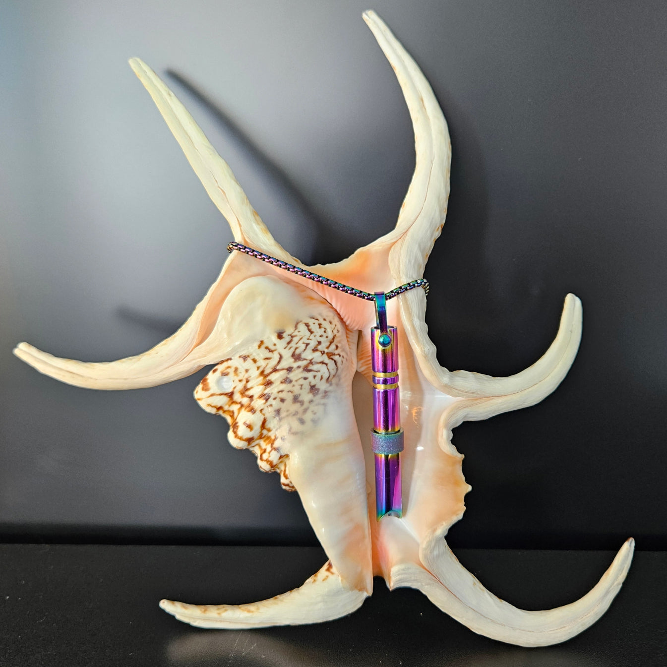The MyBreathArt Whisper Amulet.